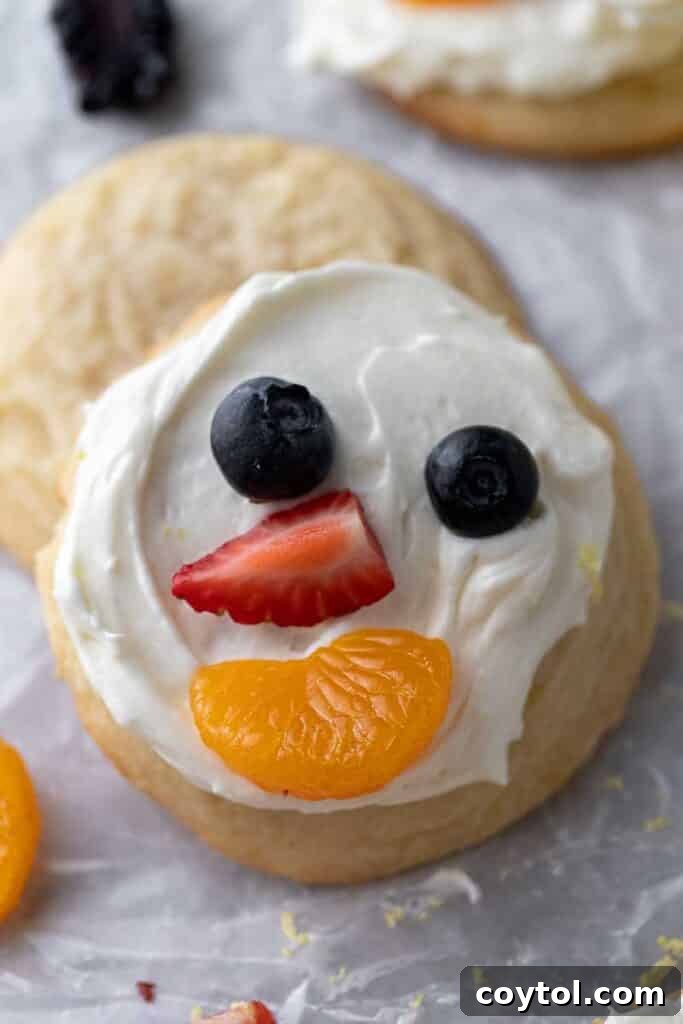 Fresh and Fruity Crumbl Cookie Pizzas 11 Close up of a smiley face fruit pizza cookie, showcasing fresh fruit decoration