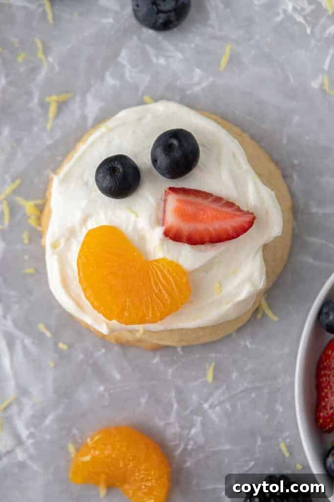 Fresh and Fruity Crumbl Cookie Pizzas 9 Frosted CRUMBL fruit pizza cookie ready to be adorned with fruit