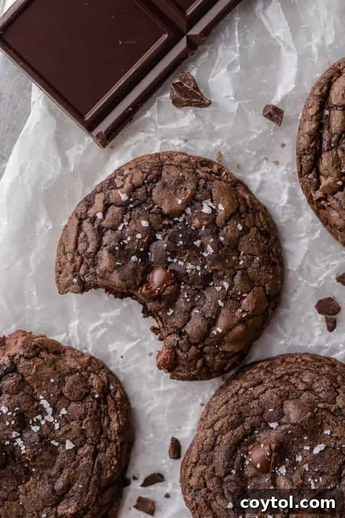 Decadent Crumbl Brownie Batter Cookies 15 Overhead shot of Crumbl brownie batter cookies arranged on a platter, showcasing their appealing crinkled tops.
