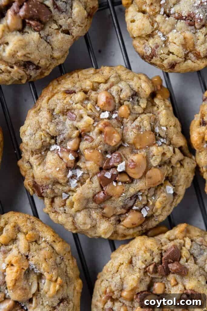 Freshly baked Crumbl Mom's Recipe Cookies on a baking sheet.