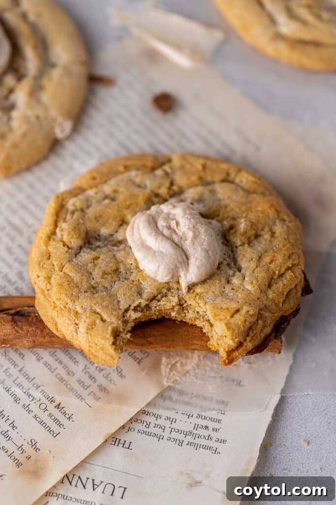 Golden Frosted Cinnamon Fry Bread Cookies 2 Large, round Crumbl Cinnamon Fry Bread cookie with a shiny, caramelized top and a swirl of cinnamon buttercream. Perfect for holidays and dessert.