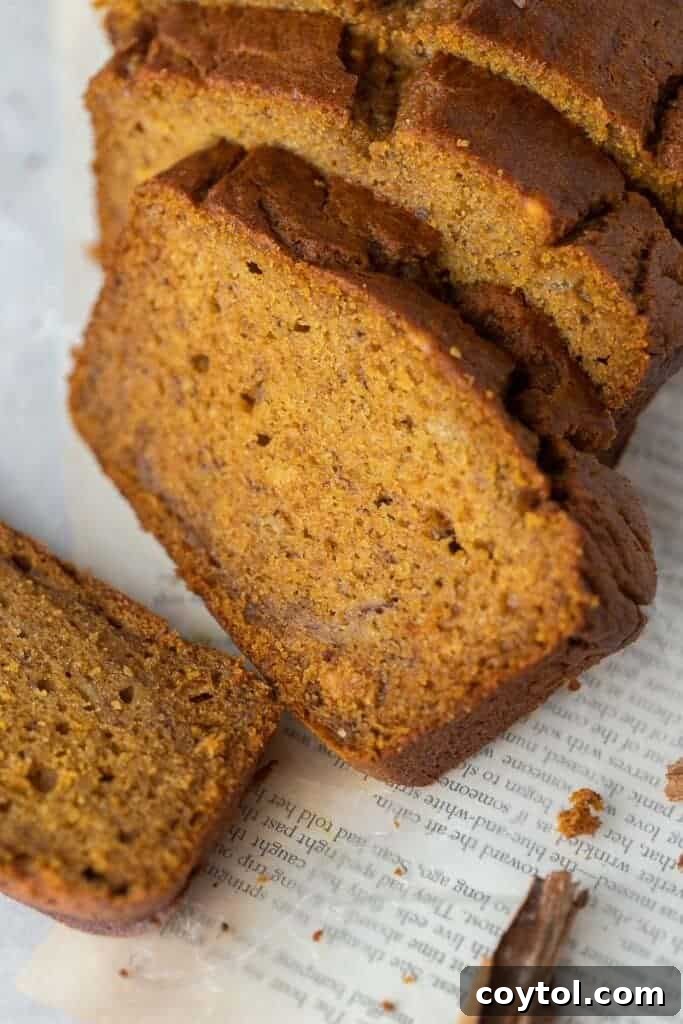 Perfectly sliced banana pumpkin bread, revealing its moist and tender interior, arranged beautifully for serving.