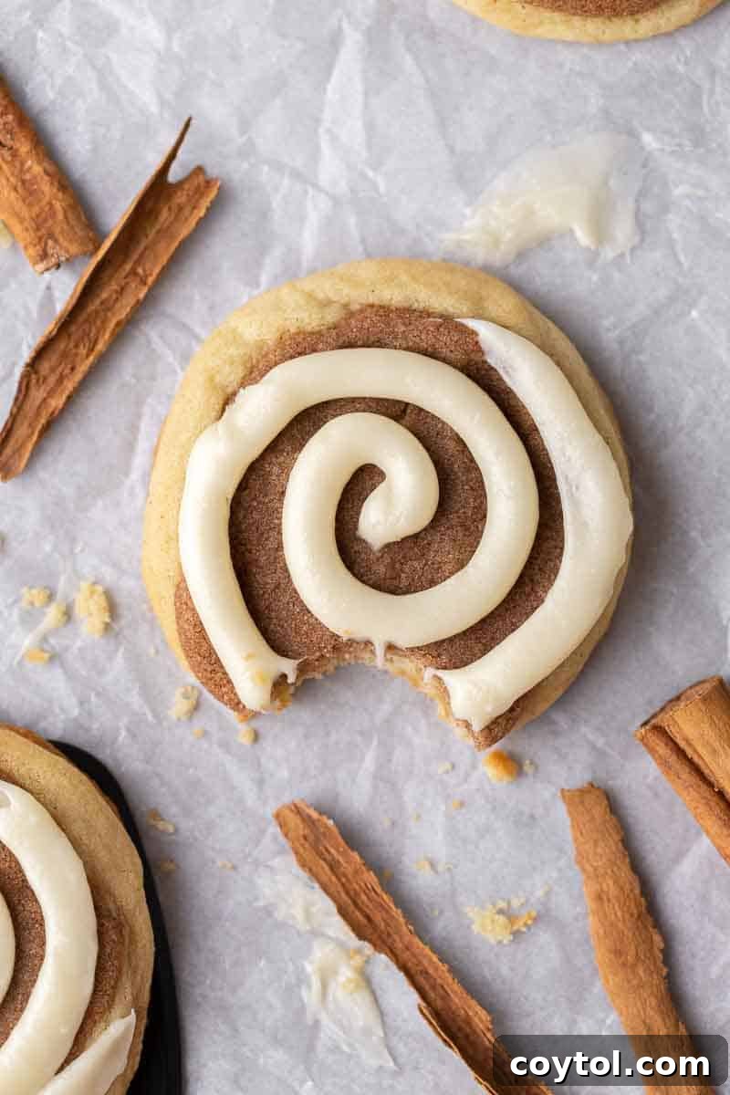 Delicious Crumbl-style Cinnamon Swirl Cookies, baked with cinnamon-sugar filling and finished with cream cheese swirl.