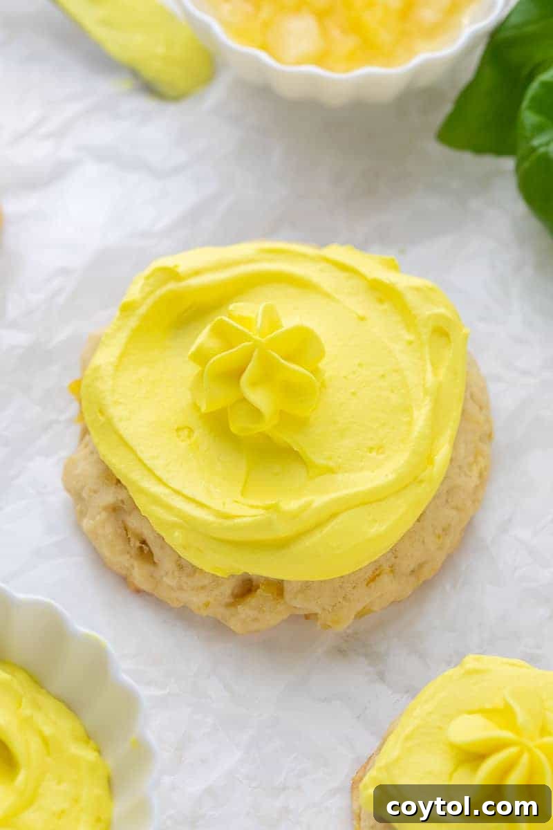 Tropical Crumbl-style Dole Whip Cookies, featuring a soft pineapple sugar cookie base and creamy pineapple-whip frosting.