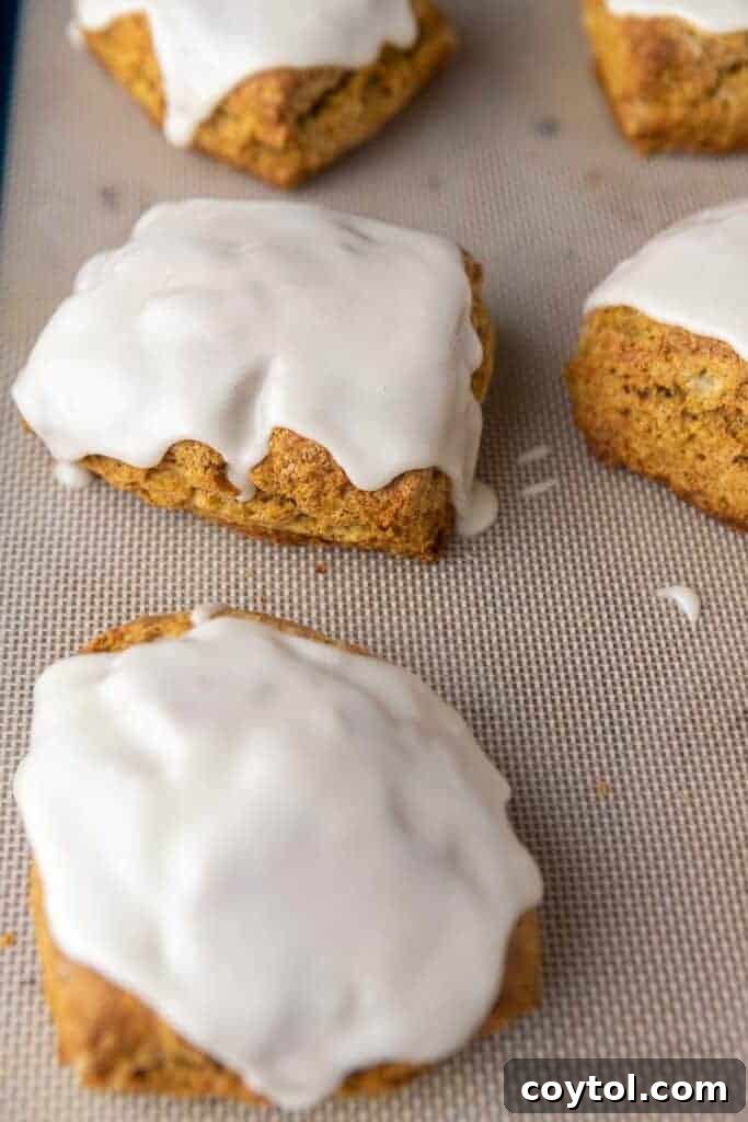 Glazed pumpkin scones stacked