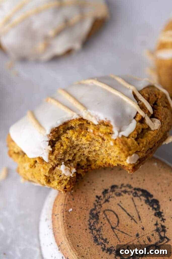 Starbucks pumpkin scone with a bite taken out of it, showing soft interior