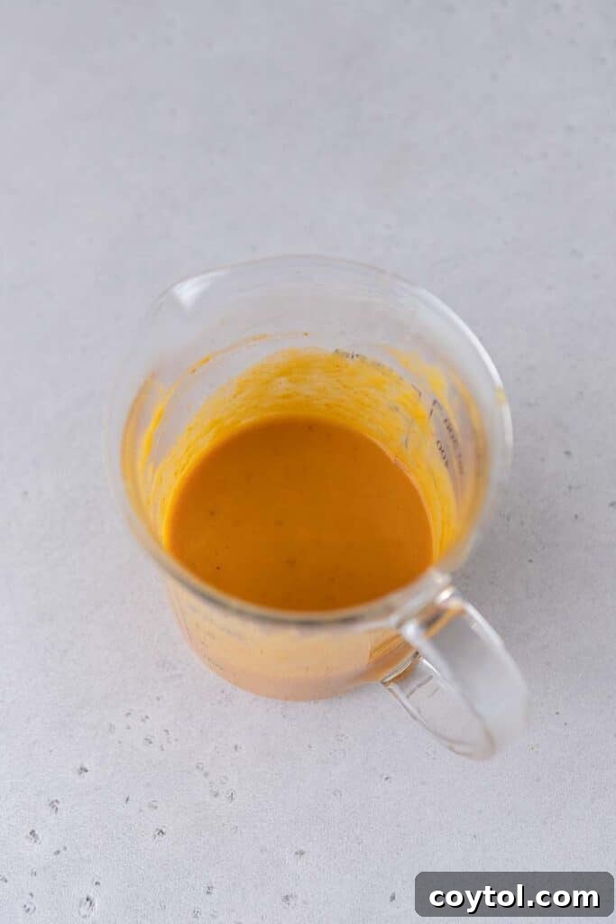 Wet ingredients in measuring cup after mixing