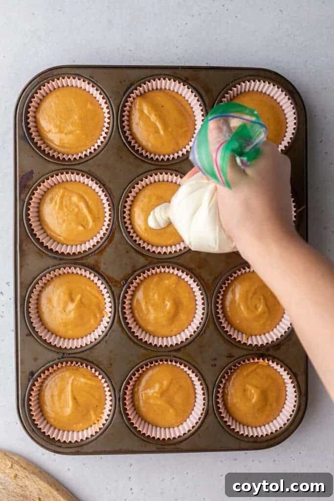 Starbucks Dupe Pumpkin Cream Cheese Muffins 13 Muffin batter in muffin tin