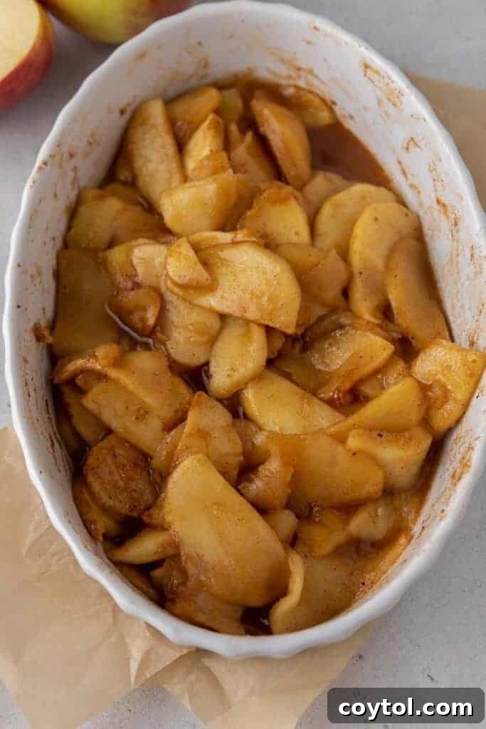 Warm baked cinnamon apples in a baking dish