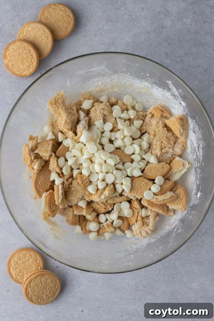 Mixing bowl with dry and wet cookie dough ingredients coming together