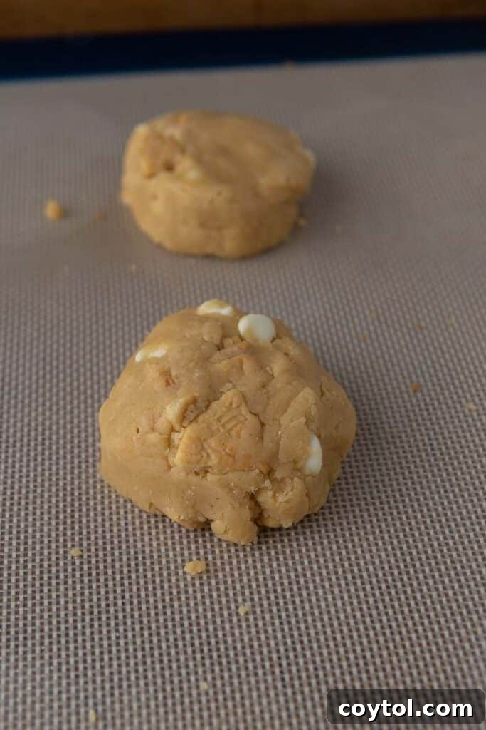Close-up of Golden Oreo cookie dough showing mixed-in pieces