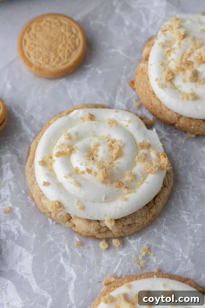 Frosted Golden Oreo Crumbl cookies with crushed Oreo topping