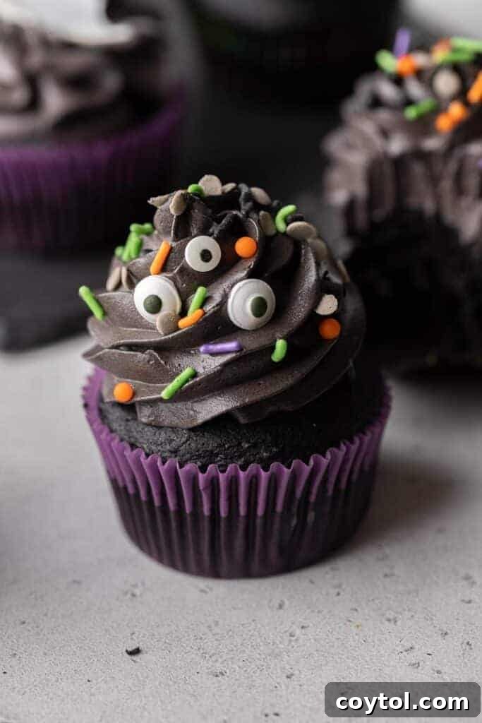 Spooky Black Velvet Monster Cupcakes 2 Halloween monster cupcakes | Black velvet cupcakes with spooky sprinkles and candy eyes