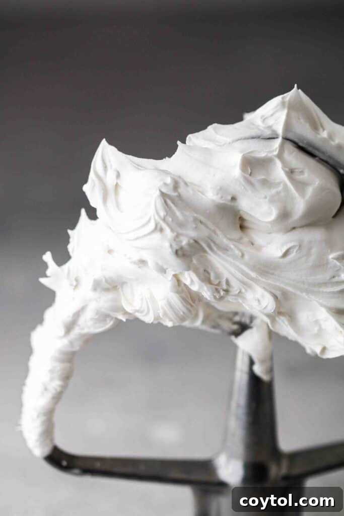 Spooky Black Velvet Monster Cupcakes 13 Close up of Swiss meringue buttercream on paddle attachment, showing smooth texture
