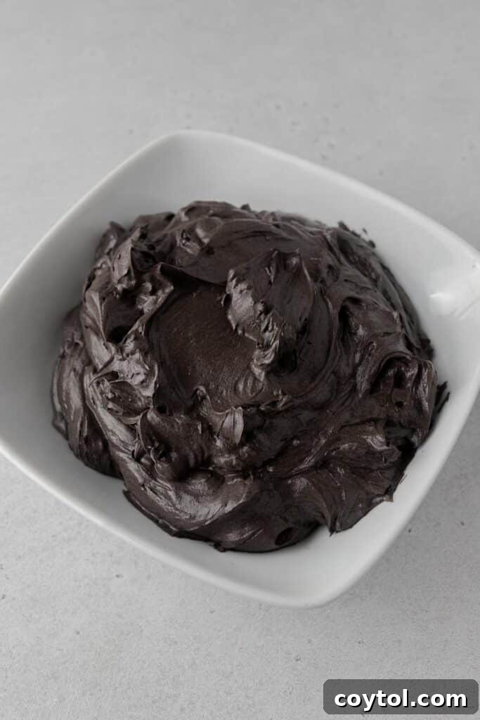 Spooky Black Velvet Monster Cupcakes 14 Rich black cocoa swiss meringue buttercream