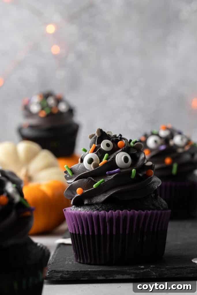 Spooky Black Velvet Monster Cupcakes 16 Single black monster cupcake with two candy eyes and sprinkles