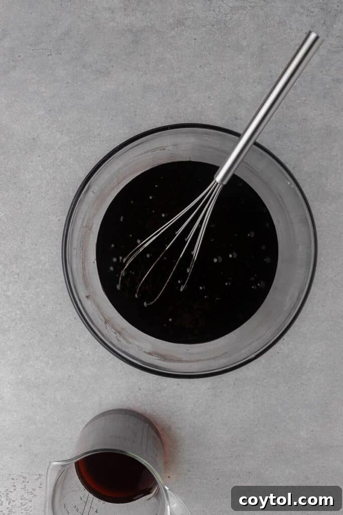 Spooky Black Velvet Monster Cupcakes 7 Smooth black cupcake batter ready for baking