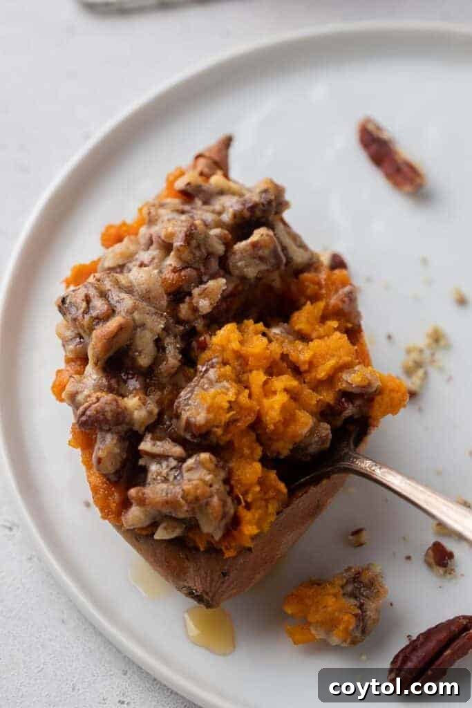 Twice-Baked Pecan Pie Sweet Potatoes 12 Pecan Pie Twice Baked Sweet Potato with a fork in it