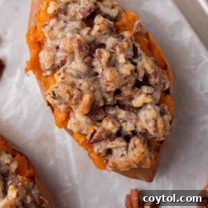 Pecan pie twice baked sweet potato with creamy maple mashed filling and chunky cinnamon pecan streusel baked until golden and bubbling