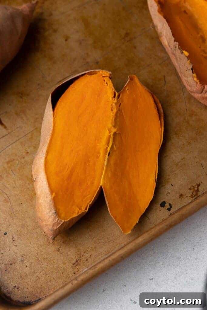 Twice-Baked Pecan Pie Sweet Potatoes 4 Roasted sweet potato sliced open revealing soft vibrant orange flesh