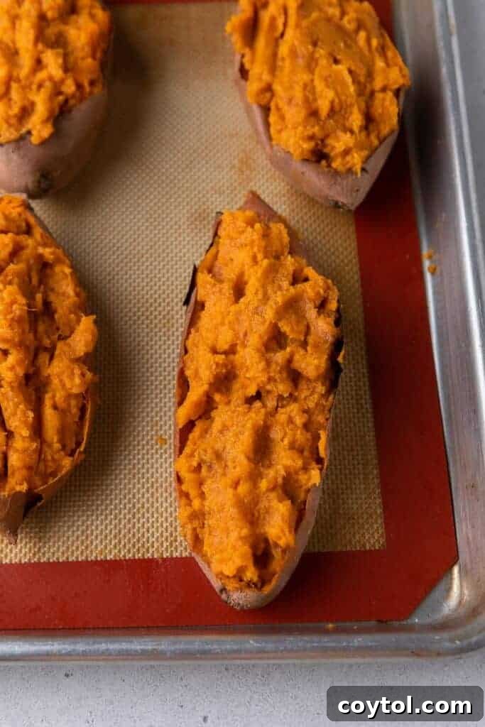 Twice-Baked Pecan Pie Sweet Potatoes 8 Sweet potatoes filled with seasoned mashed sweet potatoes on baking tray