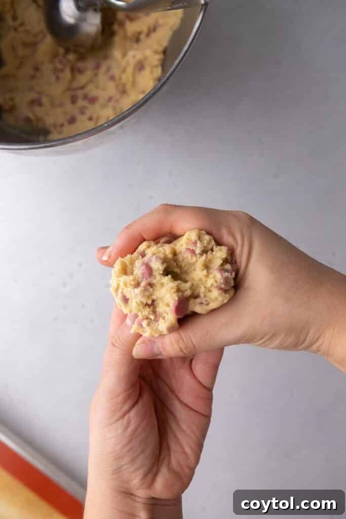 More cookie dough being reformed with jagged edges
