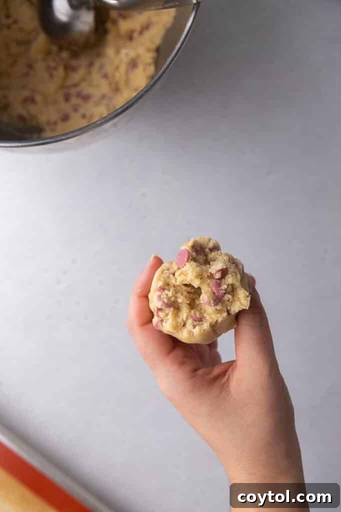 Scooped cookie dough balls on a baking sheet