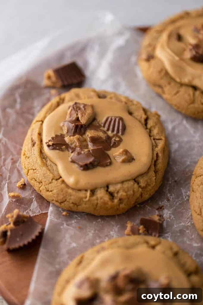 Freshly baked Crumbl Reese's cup cookies, hot and ready for topping.