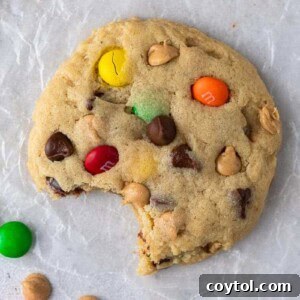 Overhead shot of Crumbl monster cookies, vibrant with M&M's and chips.