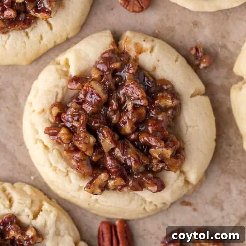Bakery-Perfect Crumbl Pecan Pie Cookies Homemade 2 Crumbl pecan pie cookies, freshly baked and topped with a glistening pecan filling.