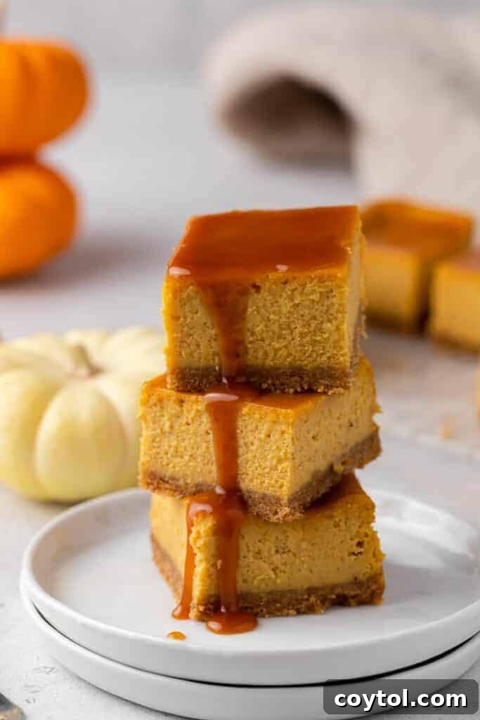 35 Irresistible Thanksgiving Desserts 18 Stack of pumpkin cheesecake bars with caramel