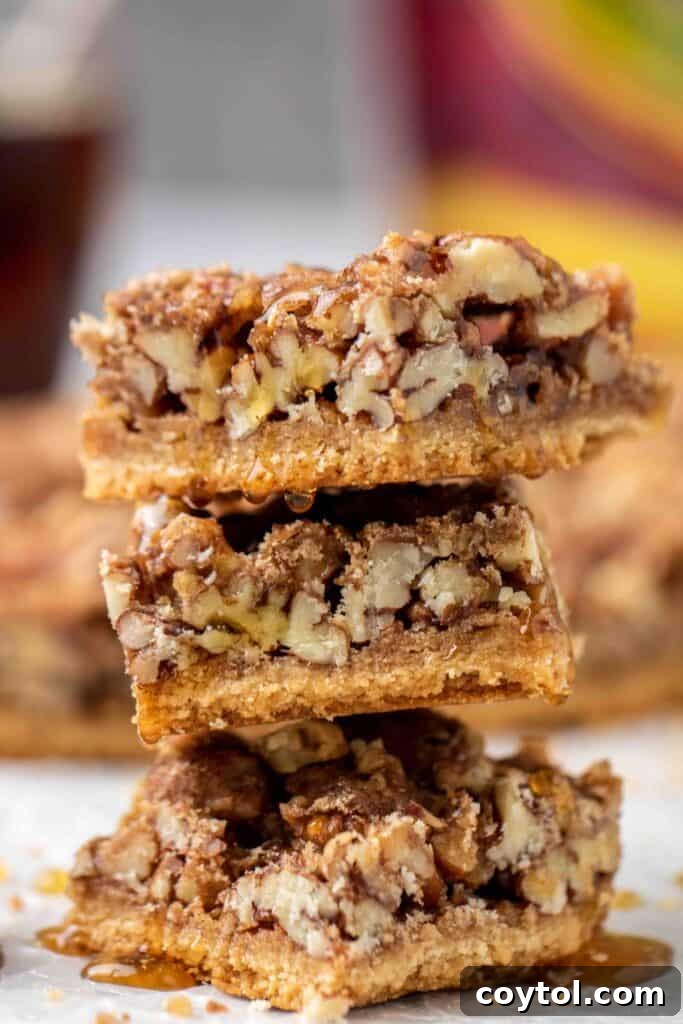 35 Irresistible Thanksgiving Desserts 8 Stack of healthy pecan pie bars with maple drizzle