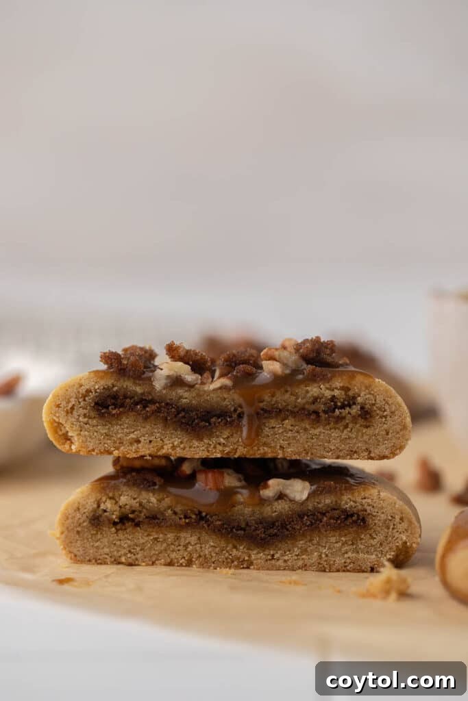 Crumbl sticky bun cookie cut in half