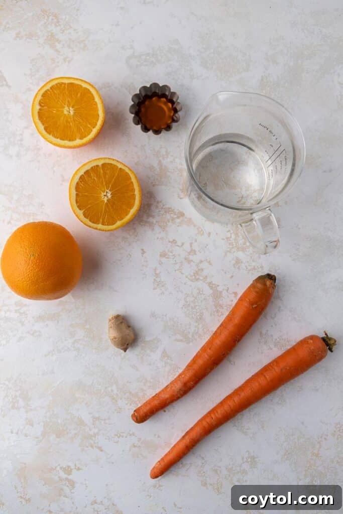 Golden Glow Immune Support Smoothie 3 Fresh oranges, carrots, and a piece of ginger root arranged neatly on a wooden cutting board, ready for smoothie preparation.
