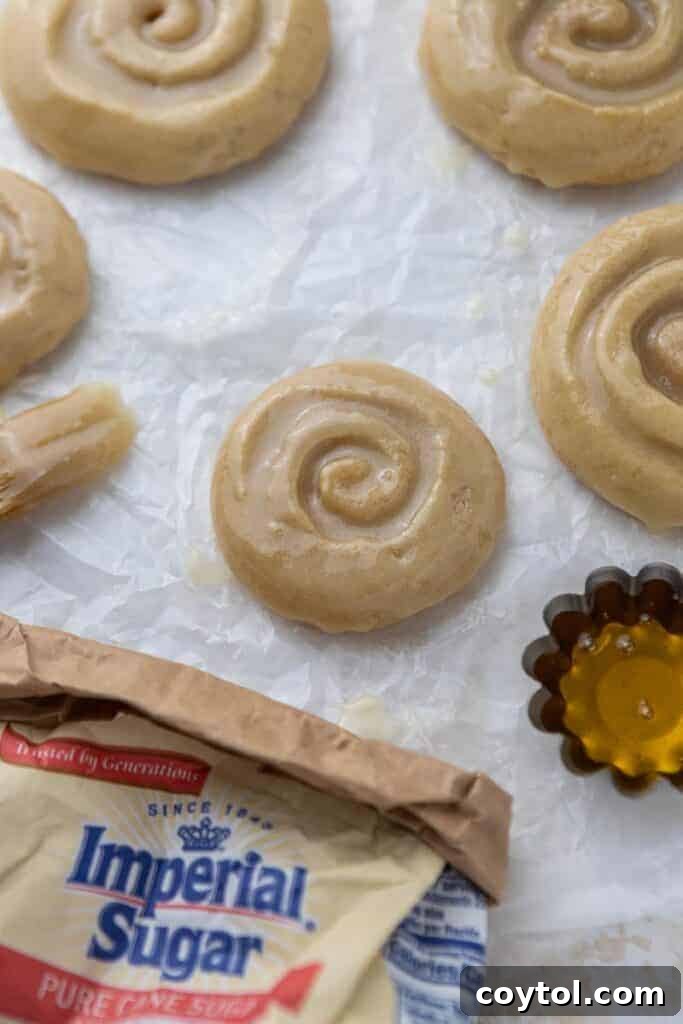 Crumbl Honey Bun Cookies: Sweet Perfection 4 Large, catering-sized Crumbl honey bun cookies arranged on a platter