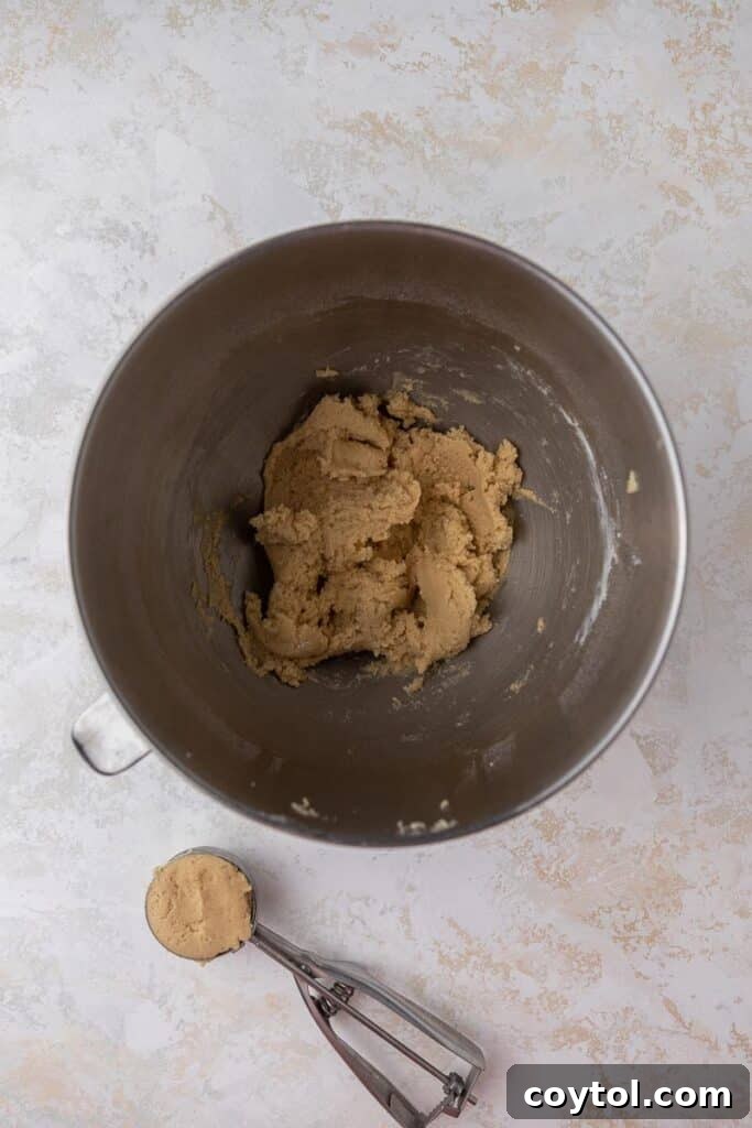 Crumbl Honey Bun Cookies: Sweet Perfection 6 Honey bun cookie dough in mixing bowl after all ingredients are combined.