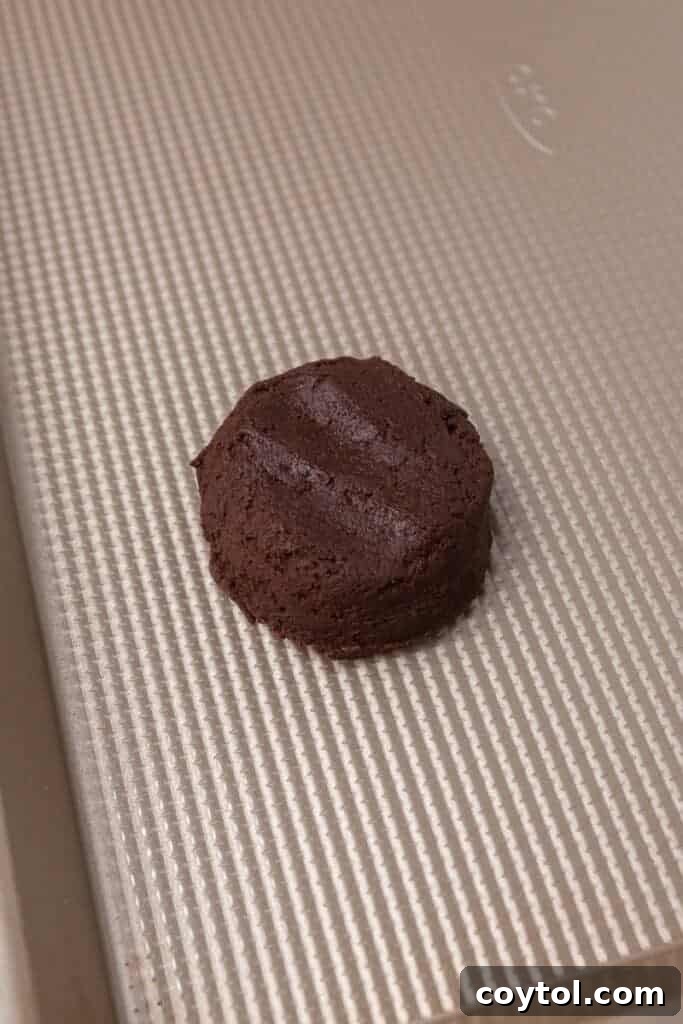 Irresistible Chilled Crumbl Heath Cake Cookies 7 chocolate cookie dough on baking sheet