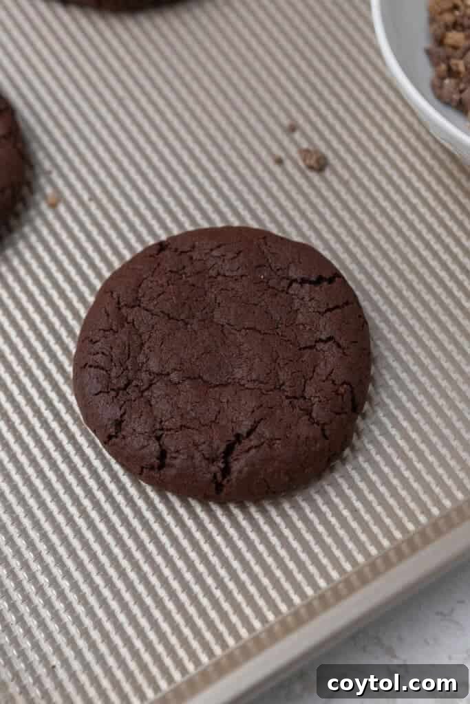 Irresistible Chilled Crumbl Heath Cake Cookies 8 Baked chocolate cookie on baking sheet
