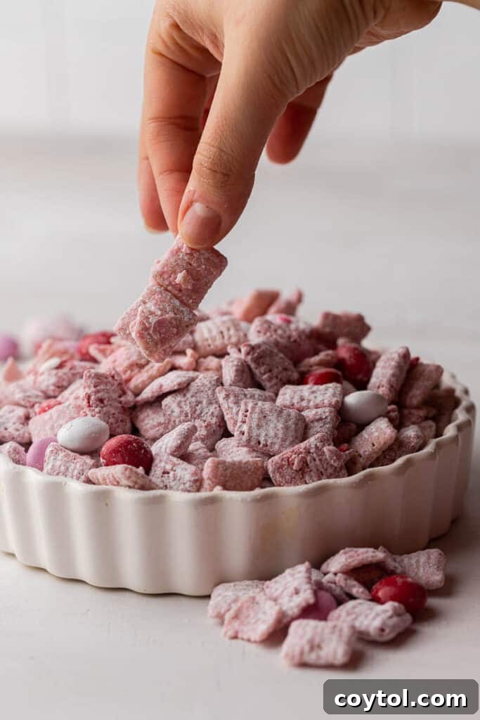 Hand grabbing Valentine's day muddy buddies