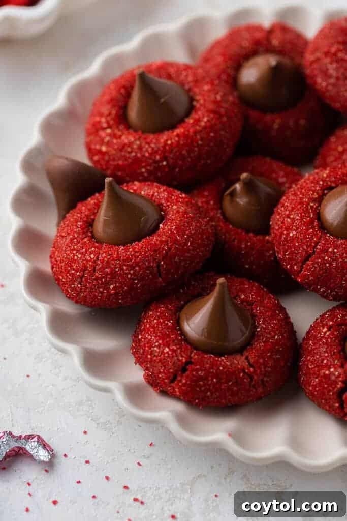 Hershey's red velvet blossoms on a plate, showcasing their vibrant red color and chocolate center
