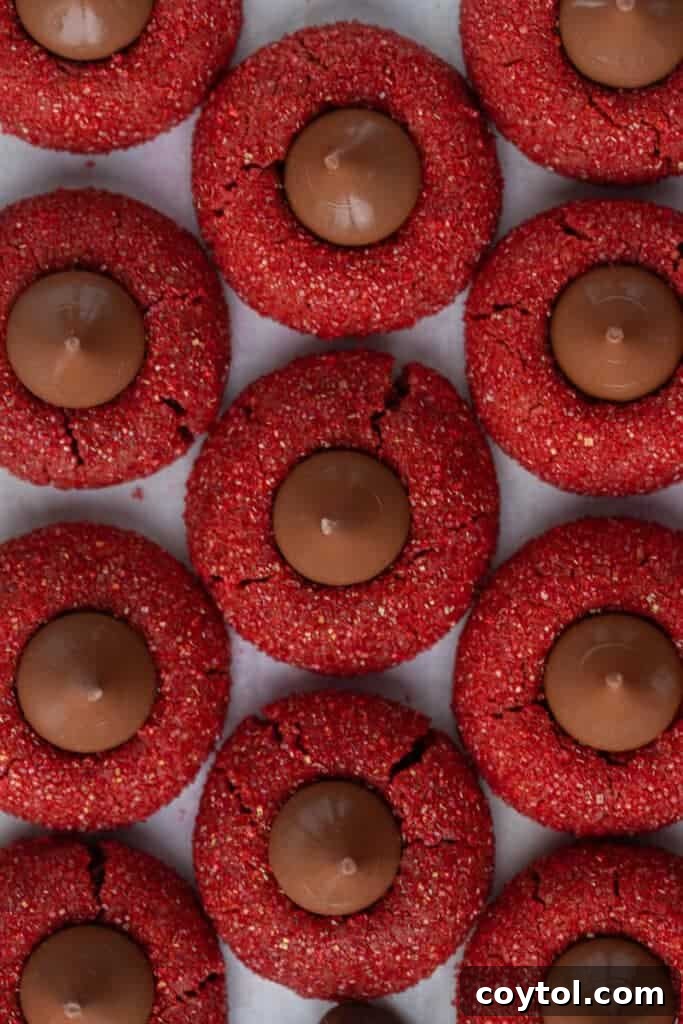 Overhead shot of freshly baked red velvet cookies with Hershey's Kisses