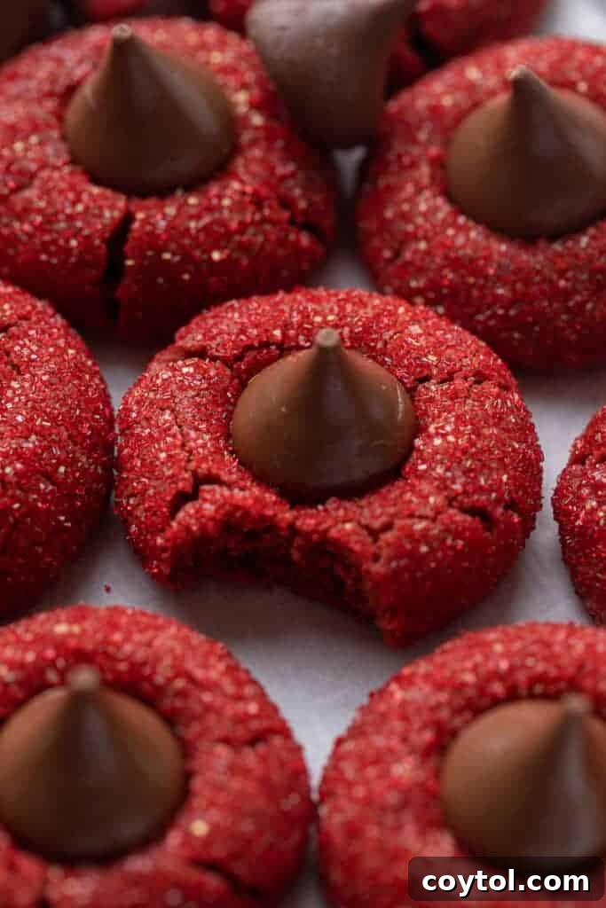 Freshly baked Hershey's red velvet blossoms with melted chocolate kisses in the center