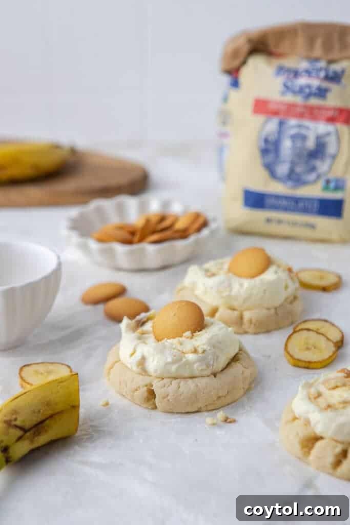 Crumbl's Sublime Chilled Banana Cream Pie Cookies 2 Close-up of a delicious Crumbl banana cream pie cookie, showcasing the creamy topping and vanilla wafer.