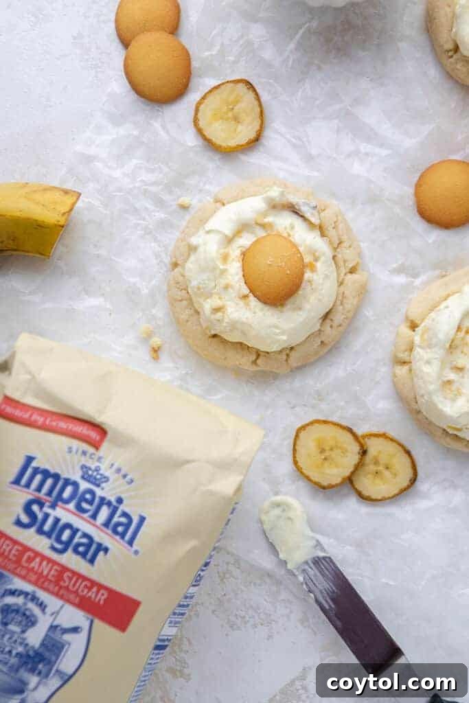 Crumbl's Sublime Chilled Banana Cream Pie Cookies 4 Batch of freshly baked sugar cookies, the base for the banana cream pie cookies, showcasing their golden-brown edges.