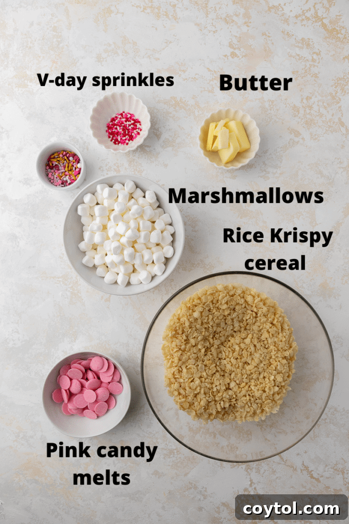 Close-up of Valentine's day rice krispy treats, showcasing the pink coating and festive sprinkles.