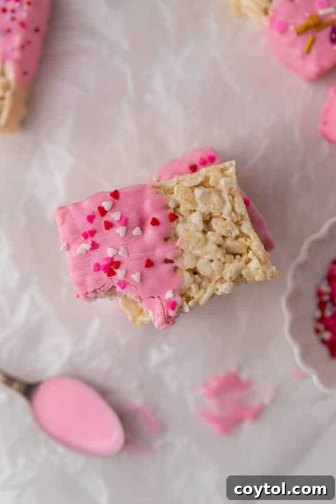 Overhead shot of Chocolate covered Rice Krispie treats, arranged attractively on a white surface.