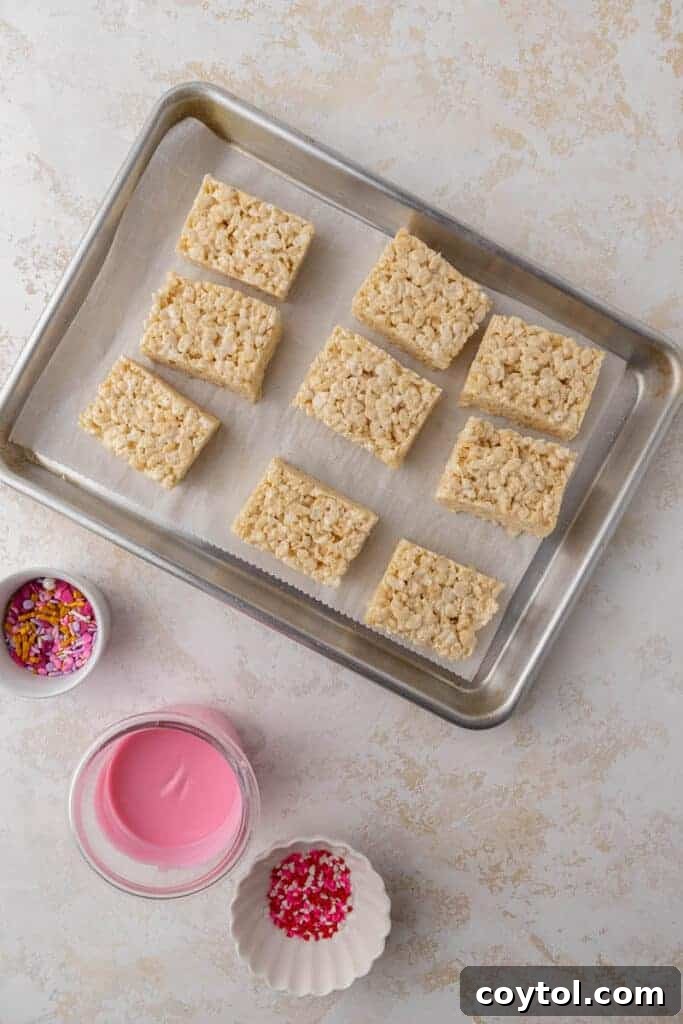 Sliced Rice Krispie treats ready for dipping.
