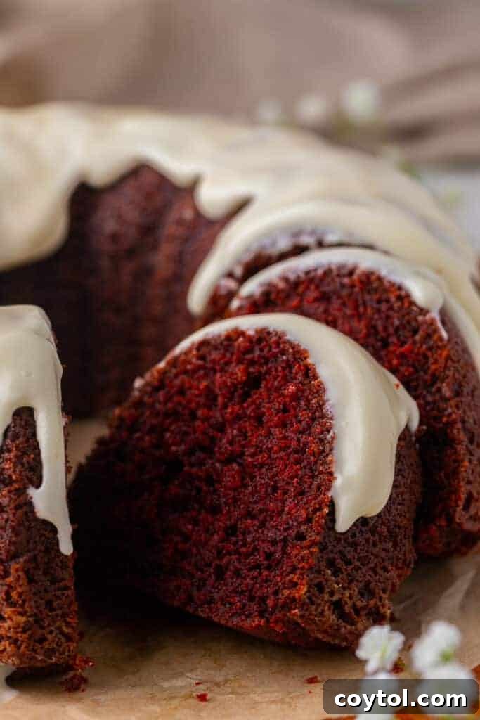 An easy red velvet bundt cake generously drizzled with a smooth cream cheese glaze, perfect for any occasion.