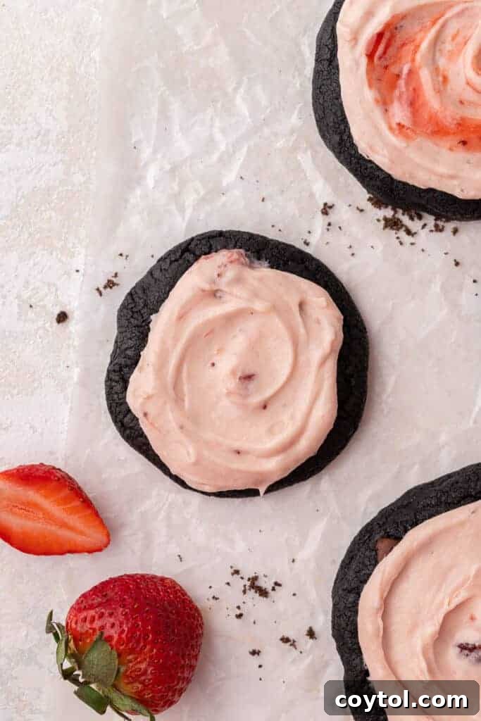 Chilled Strawberry Cheesecake Swirl Chocolate Cookies 12 Catering-sized mini Crumbl Chocolate Strawberry Cheesecake Cookies displayed on a platter.