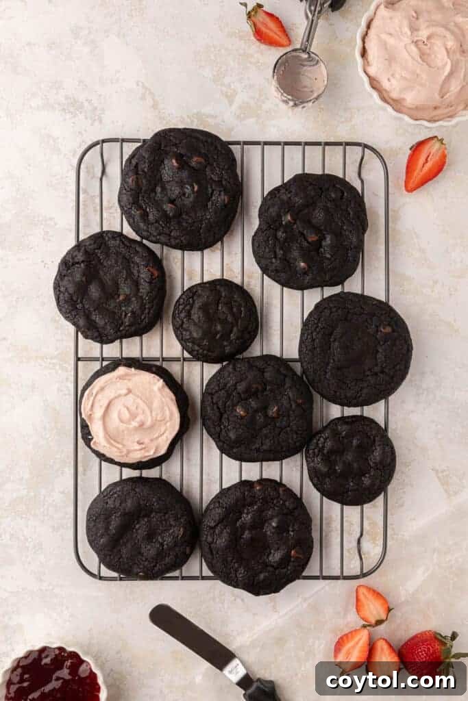 Chilled Strawberry Cheesecake Swirl Chocolate Cookies 4 Freshly baked dark cocoa cookies with strawberry cream cheese frosting, ready to be served.
